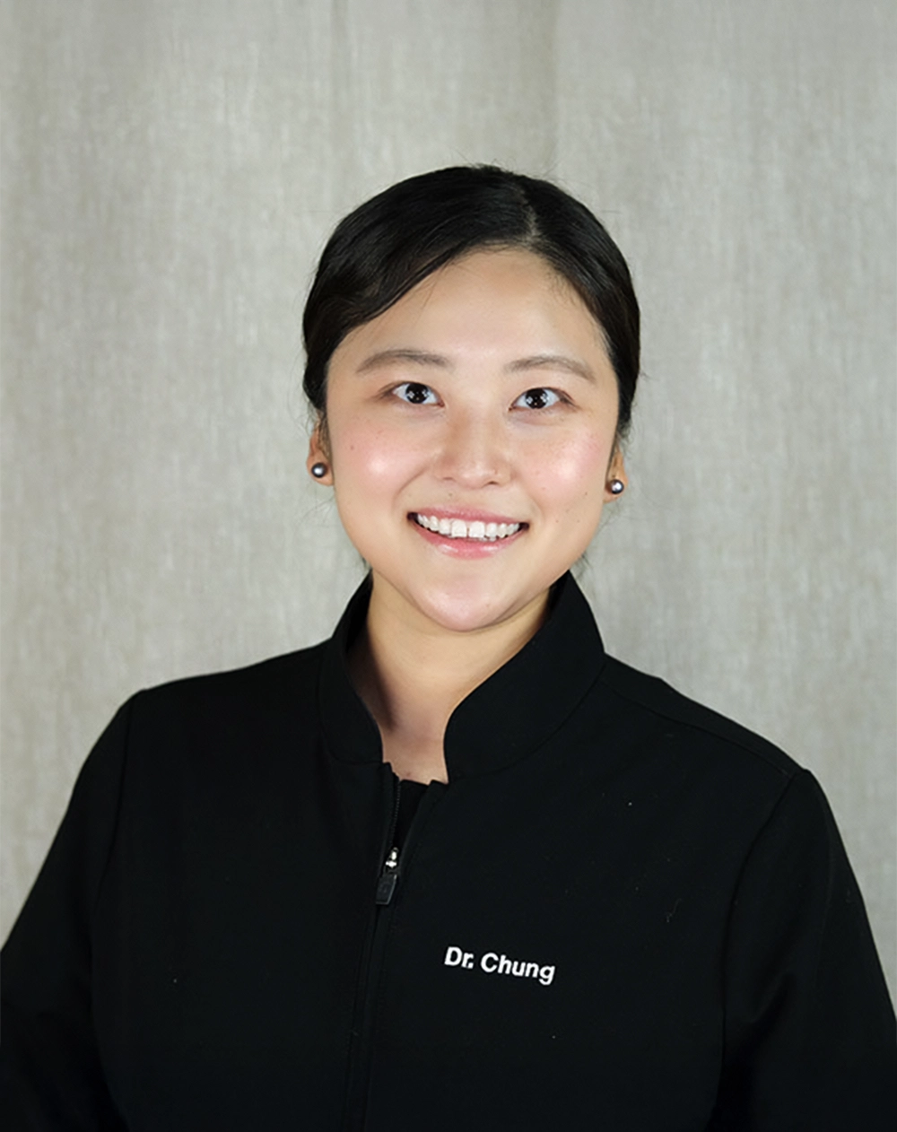 Dentist Clifton VA Deborah Chung About HP Dentist Deborah Chung Smiling And Welcoming You To Office In Collared Top